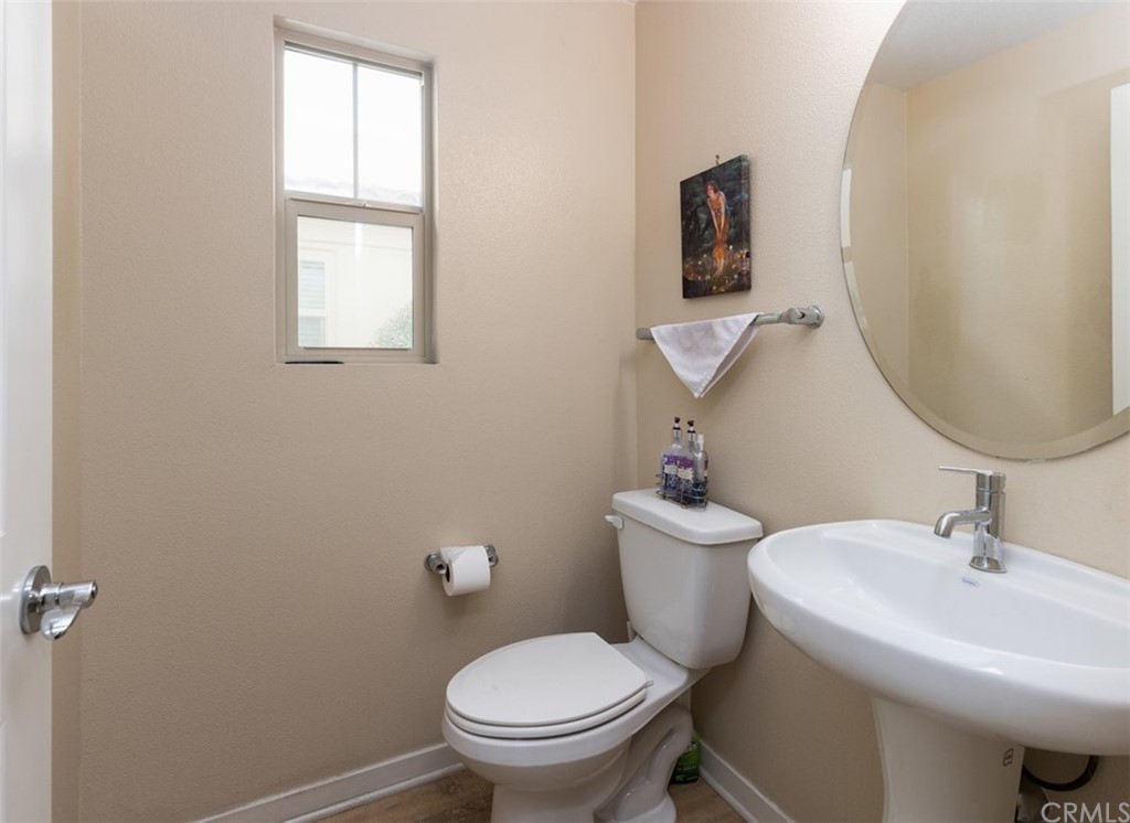 2 Adelfa Street Rancho Mission Viejo, CA 92694 - Photo 13 of 56 a bathroom with a toilet a sink and mirror
