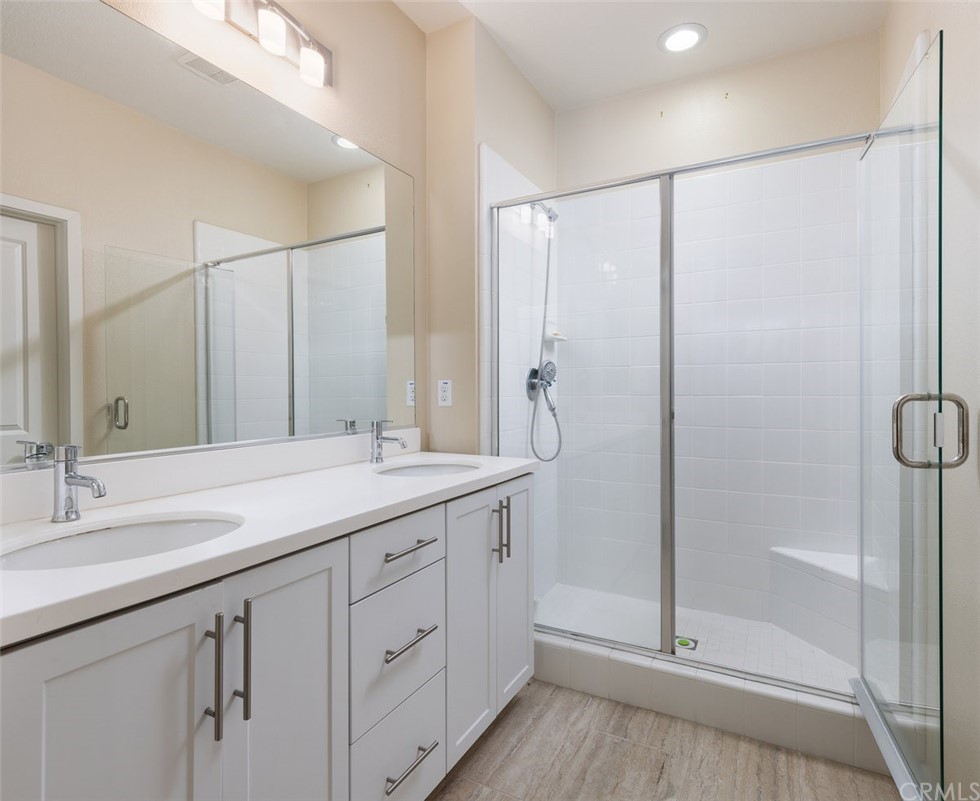 2 Adelfa Street Rancho Mission Viejo, CA 92694 - Photo 17 of 56 a bathroom with a granite countertop sink mirror and double