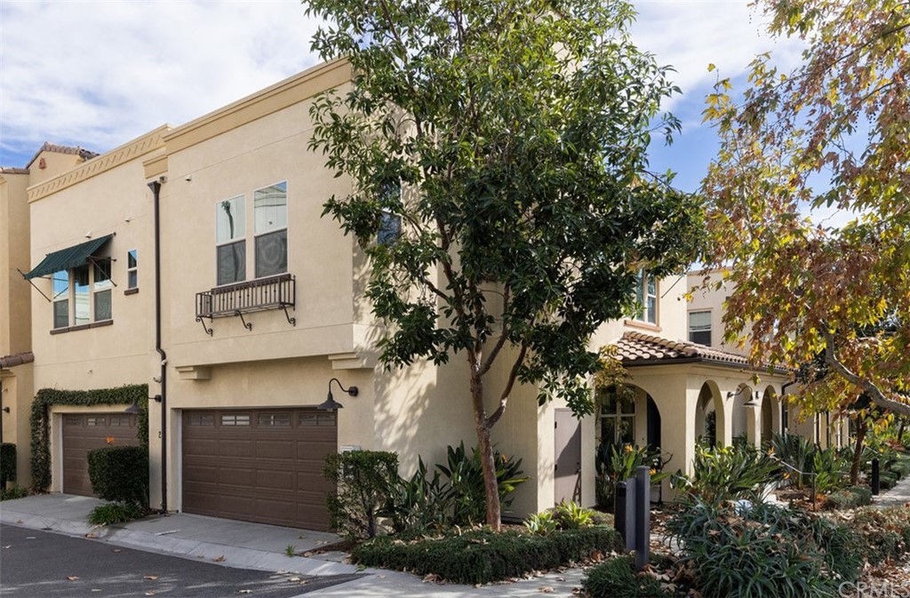 2 Adelfa Street Rancho Mission Viejo, CA 92694 - Photo 22 of 56 a front view of a white house with a tree