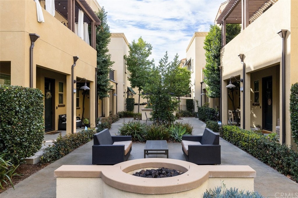 2 Adelfa Street Rancho Mission Viejo, CA 92694 - Photo 24 of 56 a view of a patio with couches a table and chairs and potted plants
