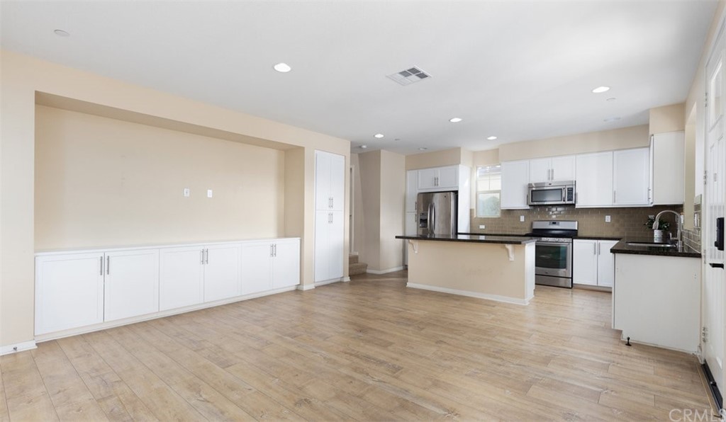 2 Adelfa Street Rancho Mission Viejo, CA 92694 - Photo 6 of 56 a large kitchen with stainless steel appliances granite countertop a stove a sink and a refrigerator