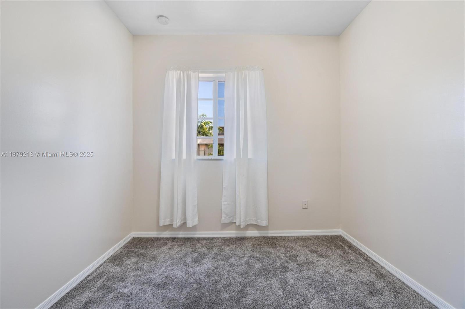 9135 Southwest 203rd Terrace Cutler Bay, FL 33189 - Photo 21 of 27 a view of an empty room with window