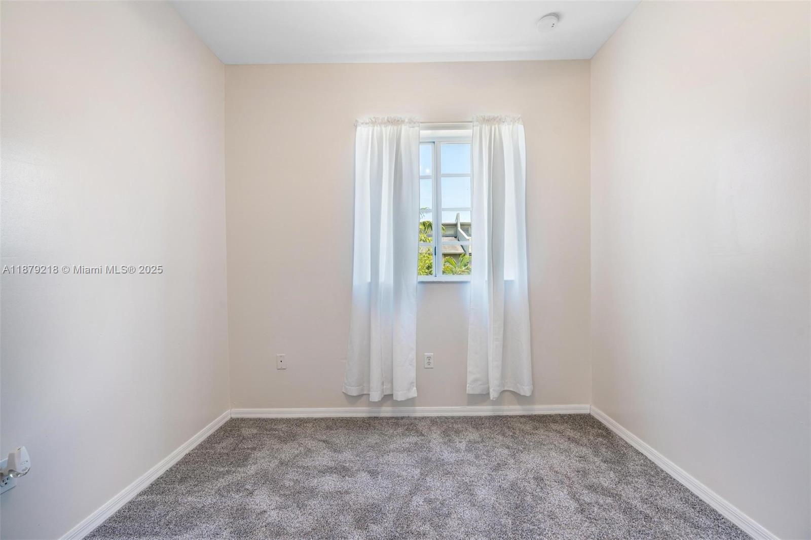 9135 Southwest 203rd Terrace Cutler Bay, FL 33189 - Photo 23 of 27 a view of an empty room with window