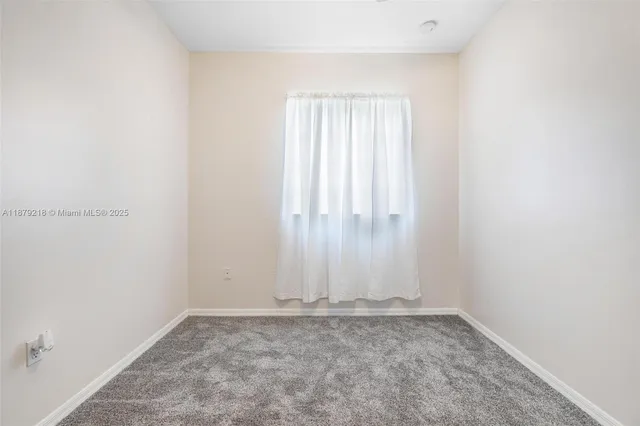 a bathroom with a sink toilet and a mirror
