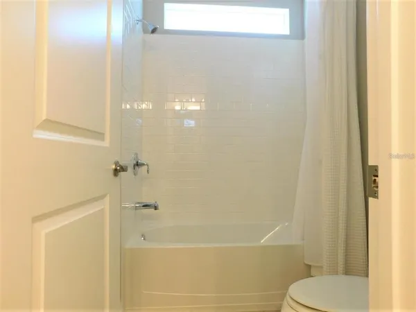 a bedroom with a bed and closet