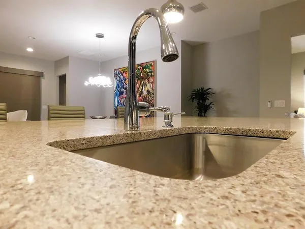 a view of a swimming pool with chairs