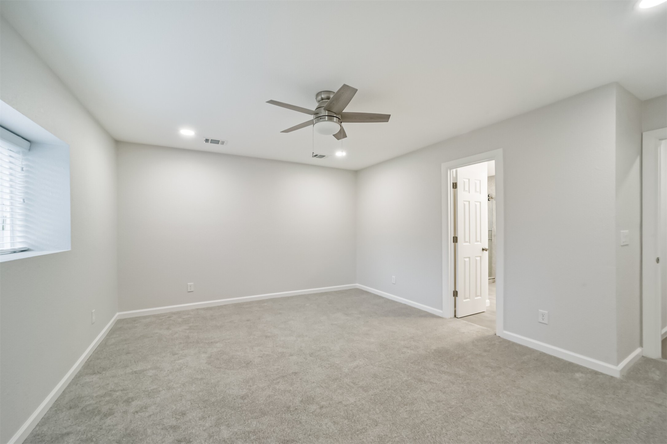 15610 Ripplewind Lane Houston, TX 77068 - Photo 20 of 44 wooden floor in an empty room with a window
