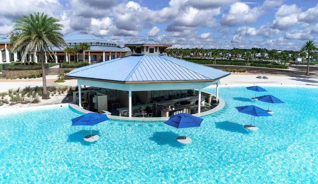 a view of a house with a yard balcony and sitting area
