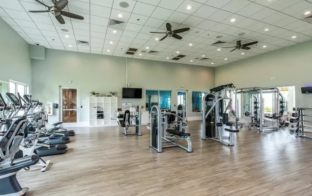 a view of a room with lots of wooden furniture