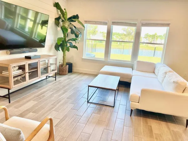 a living room with furniture and a window