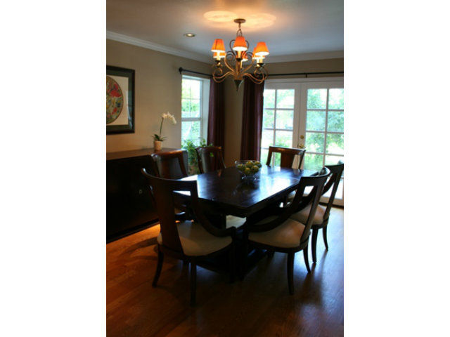 14754 Bronson Avenue San Jose, CA 95124 - Photo 3 of 18 a dining room with wooden floor a chandelier a wooden table and chairs