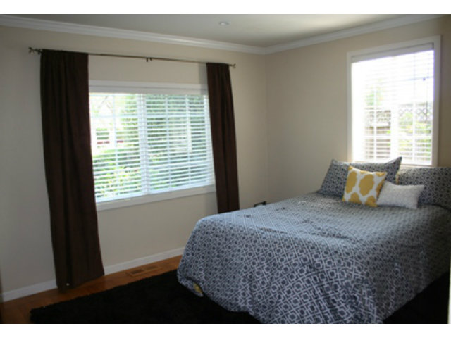 14754 Bronson Avenue San Jose, CA 95124 - Photo 8 of 18 a bedroom with a bed and window