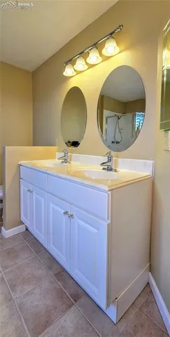 a bathroom with a sink and mirror