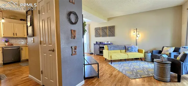 a bed room with furniture and a wooden floor