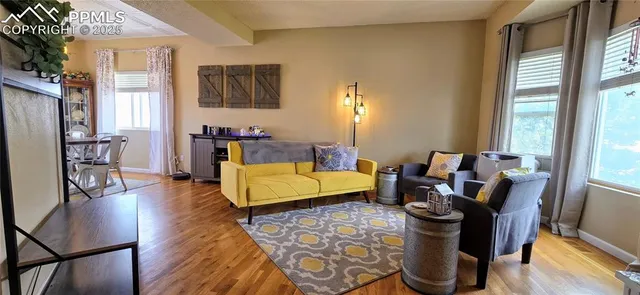 a living room with furniture and a table