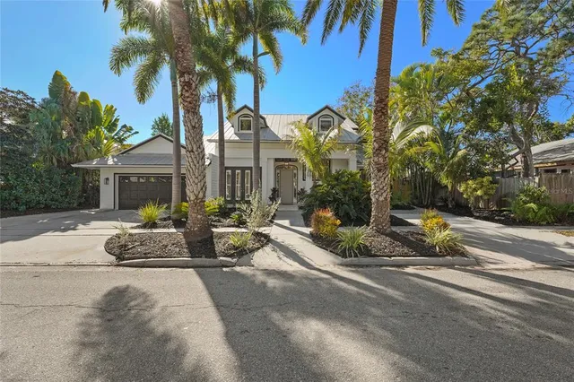 an aerial view of residential houses with city view