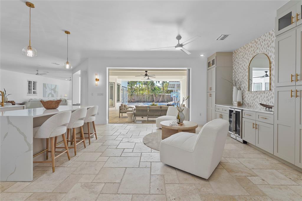 1826 Boyce Street Sarasota, FL 34239 - Photo 11 of 98 a living room with furniture a large window and kitchen view
