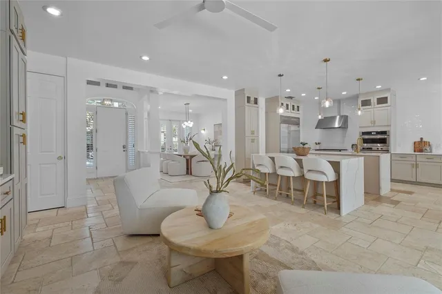 a kitchen with cabinets appliances and a sink