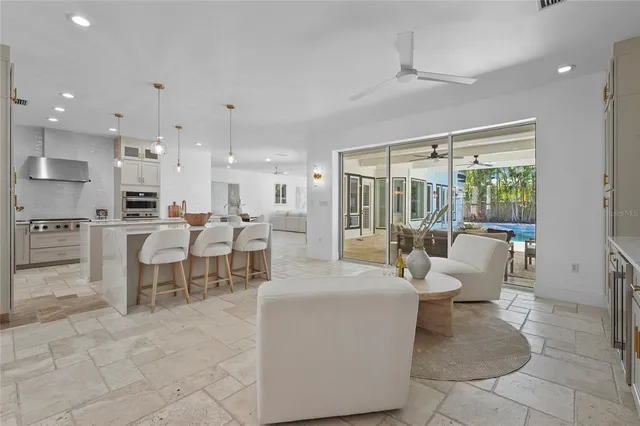 a dining room with furniture and a chandelier