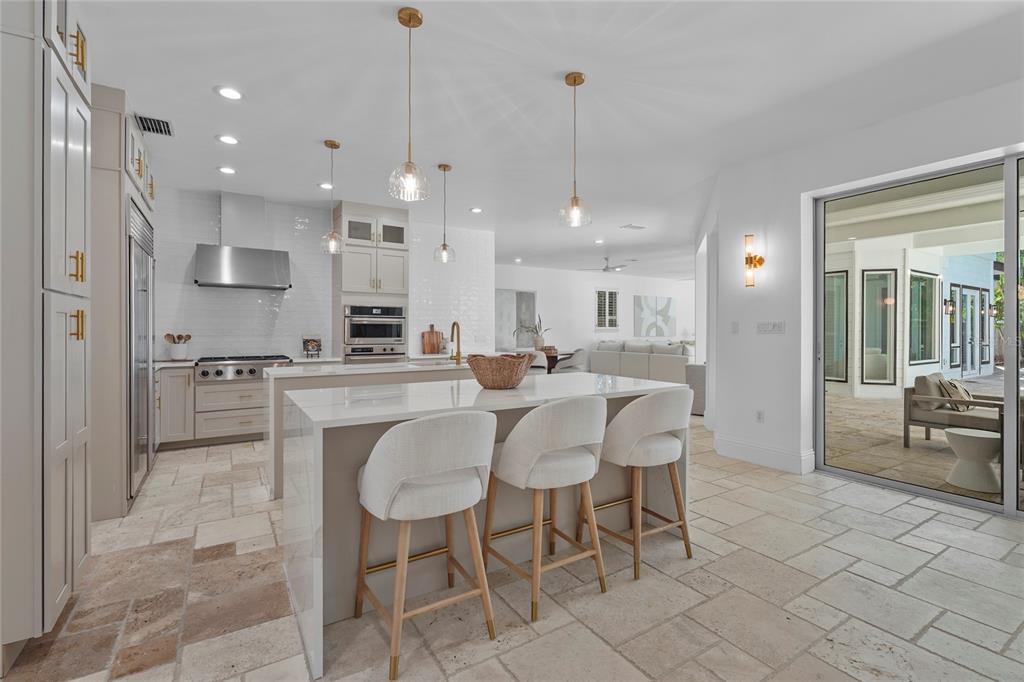 1826 Boyce Street Sarasota, FL 34239 - Photo 16 of 98 a large kitchen with a table and chairs