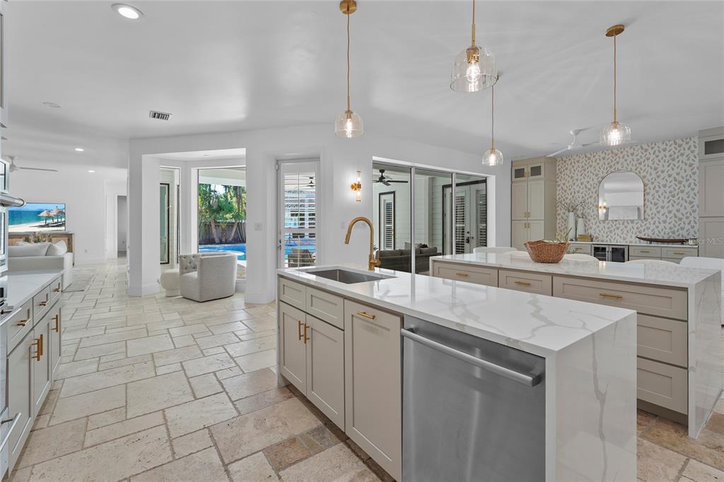 1826 Boyce Street Sarasota, FL 34239 - Photo 20 of 98 a large white kitchen with a sink a counter space appliances and cabinets