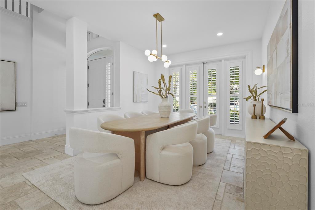 1826 Boyce Street Sarasota, FL 34239 - Photo 22 of 98 a dining room with furniture and a chandelier
