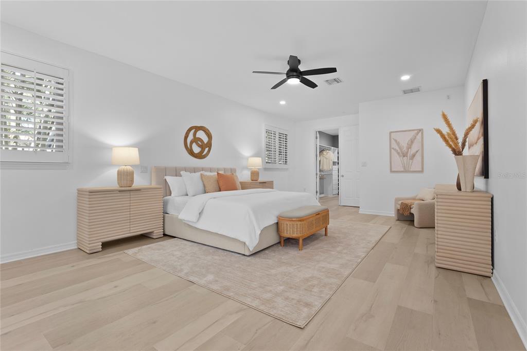 1826 Boyce Street Sarasota, FL 34239 - Photo 31 of 98 a bedroom with a bed and a chandelier