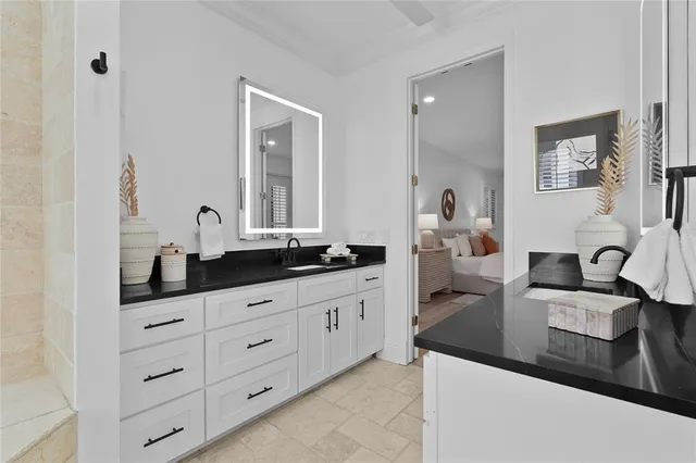 a bathroom with a sink a toilet and mirror