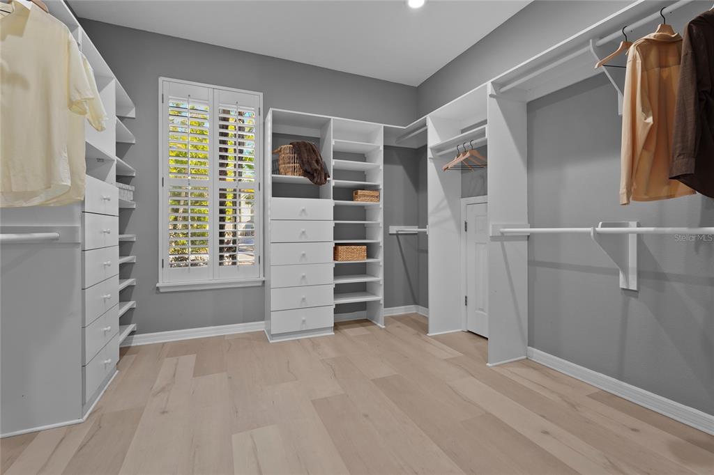 1826 Boyce Street Sarasota, FL 34239 - Photo 41 of 98 a view of walk in closet with clothes and shoes