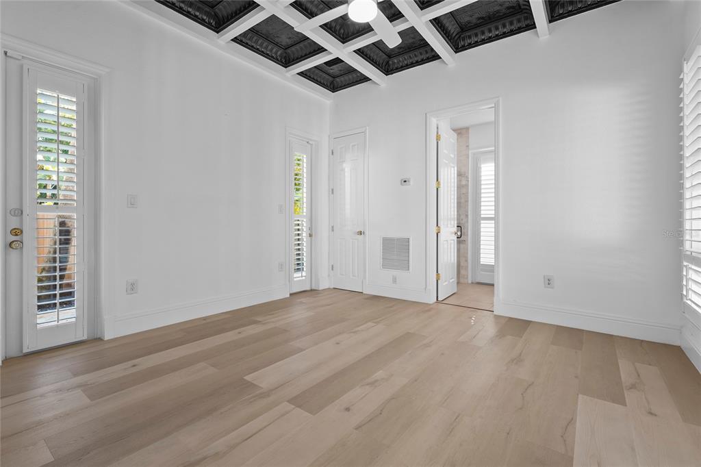 1826 Boyce Street Sarasota, FL 34239 - Photo 44 of 98 an empty room with wooden floor and windows