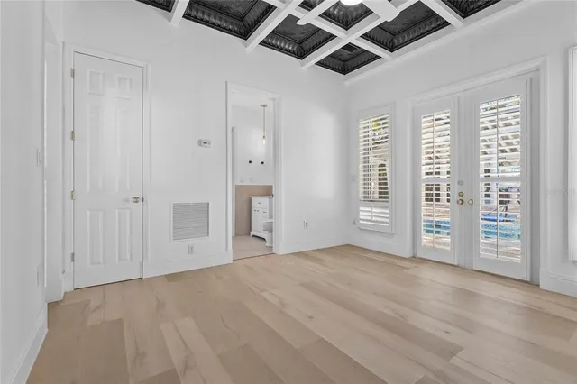 a view of empty room with wooden walls