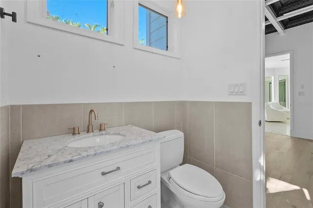 a living room with furniture and large windows