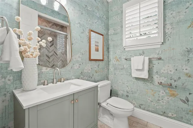 a view of a house with a backyard porch and sitting area