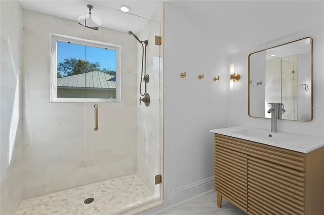 an aerial view of residential houses with city view