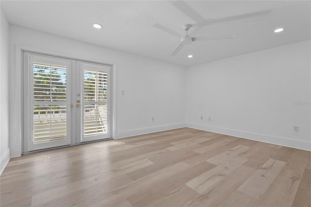 1826 Boyce Street Sarasota, FL 34239 - Photo 66 of 98 wooden floor in an empty room with a window