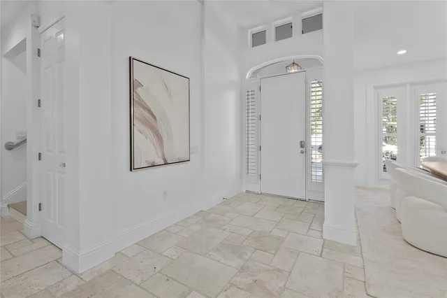 a large kitchen with a table and chairs