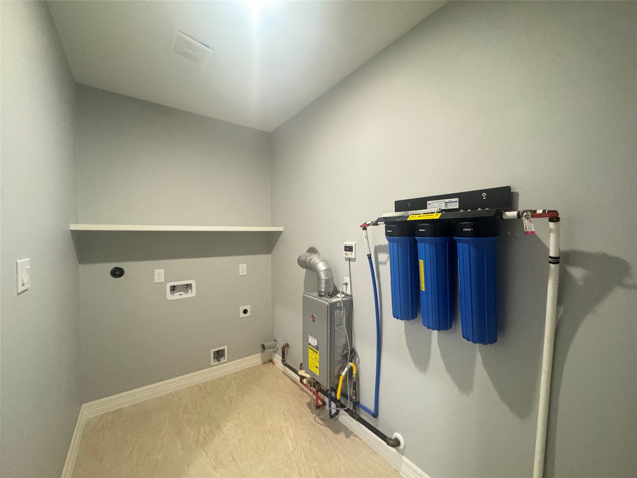 2010 Cherry Laurel Spring, TX 77386 - Photo 23 of 45 Utility room with gas dryer connection, whole house water purification system.