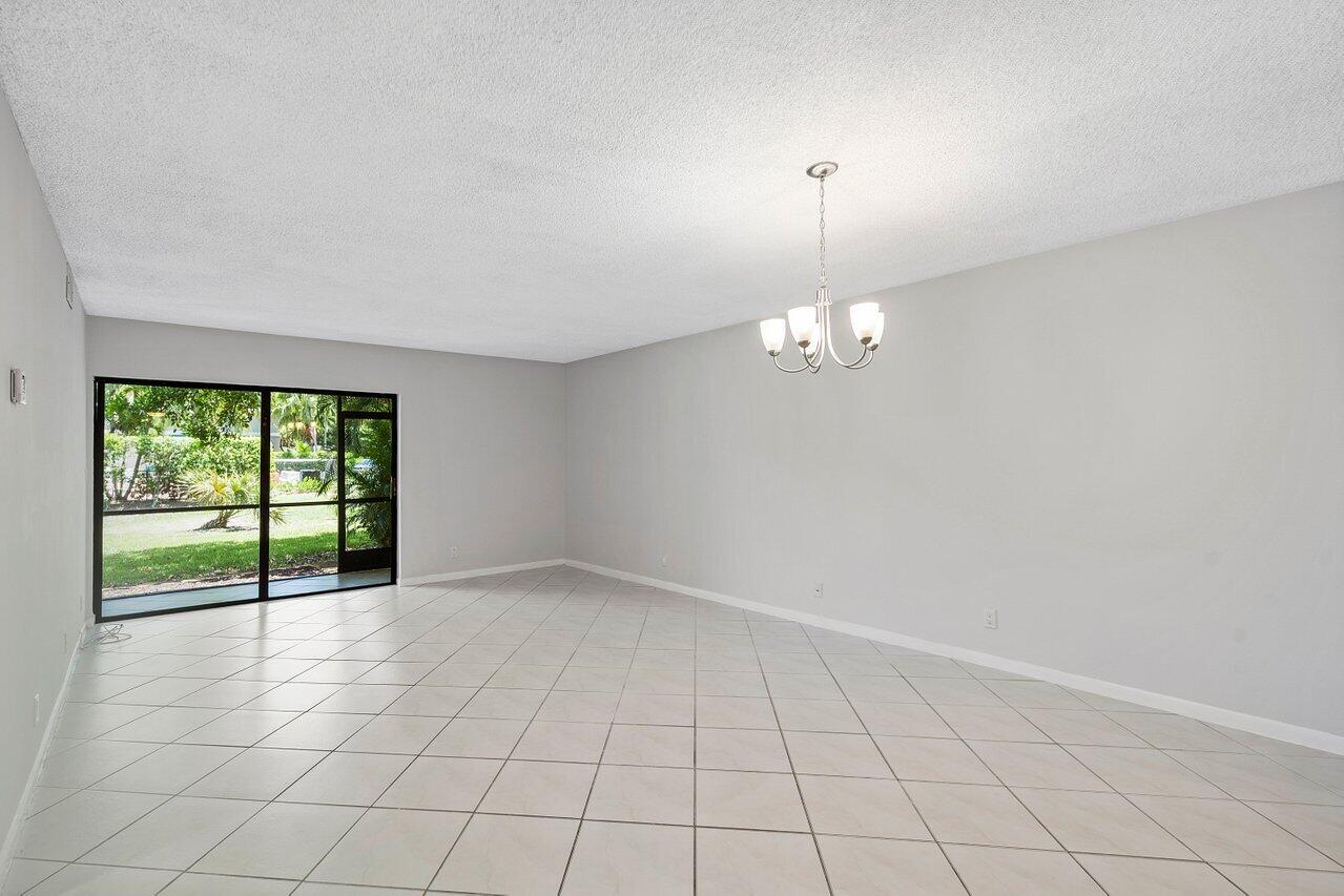 150 Northwest 70th Street, Unit 104 Boca Raton, FL 33487 - Photo 3 of 27 Tiled Living Area