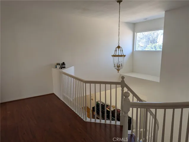 a view of a hallway with windows