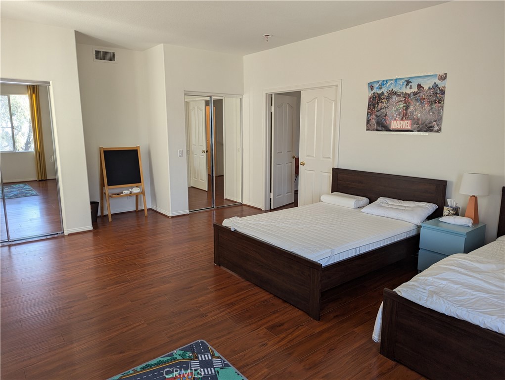 18536 Vantage Pointe Drive Rowland Heights, CA 91748 - Photo 22 of 34 a room with two beds and wooden floor