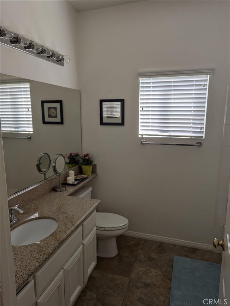 18536 Vantage Pointe Drive Rowland Heights, CA 91748 - Photo 24 of 34 a bathroom with a granite countertop sink and a toilet