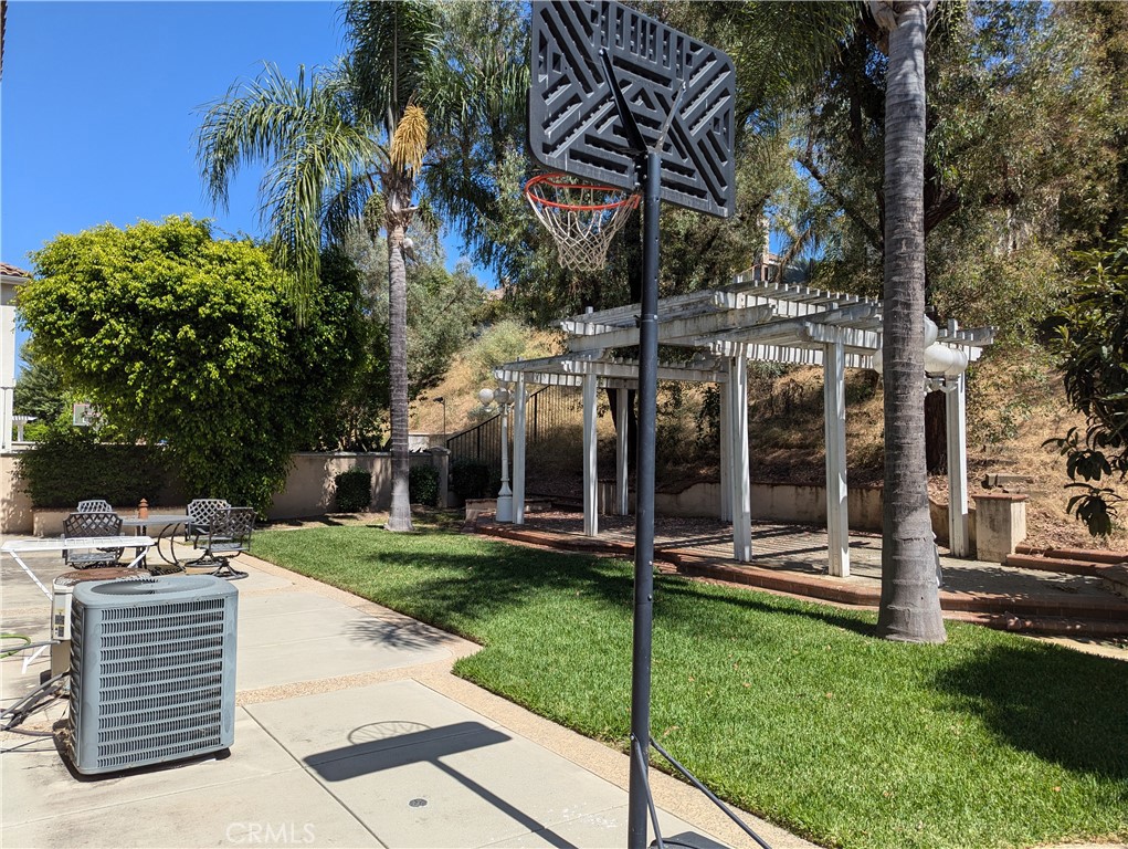 18536 Vantage Pointe Drive Rowland Heights, CA 91748 - Photo 32 of 34 a view of a house with a yard and a tree