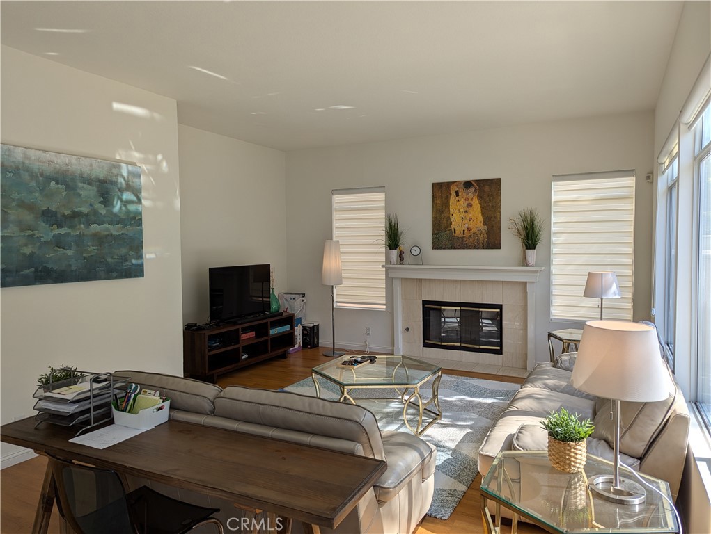 18536 Vantage Pointe Drive Rowland Heights, CA 91748 - Photo 6 of 34 a living room with furniture a fireplace and a flat screen tv