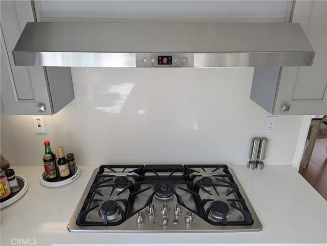 a close view of a sink and cabinets in a room