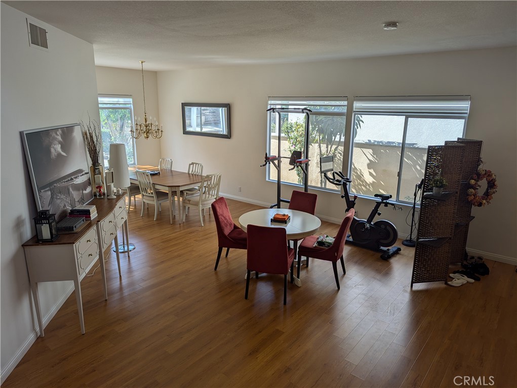 18536 Vantage Pointe Drive Rowland Heights, CA 91748 - Photo 10 of 34 a view of a dining room with furniture window and wooden floor