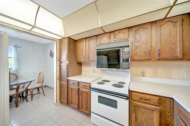 a kitchen with a stove and a microwave