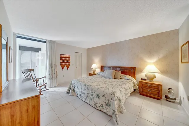 a bedroom with a bed and a table in it