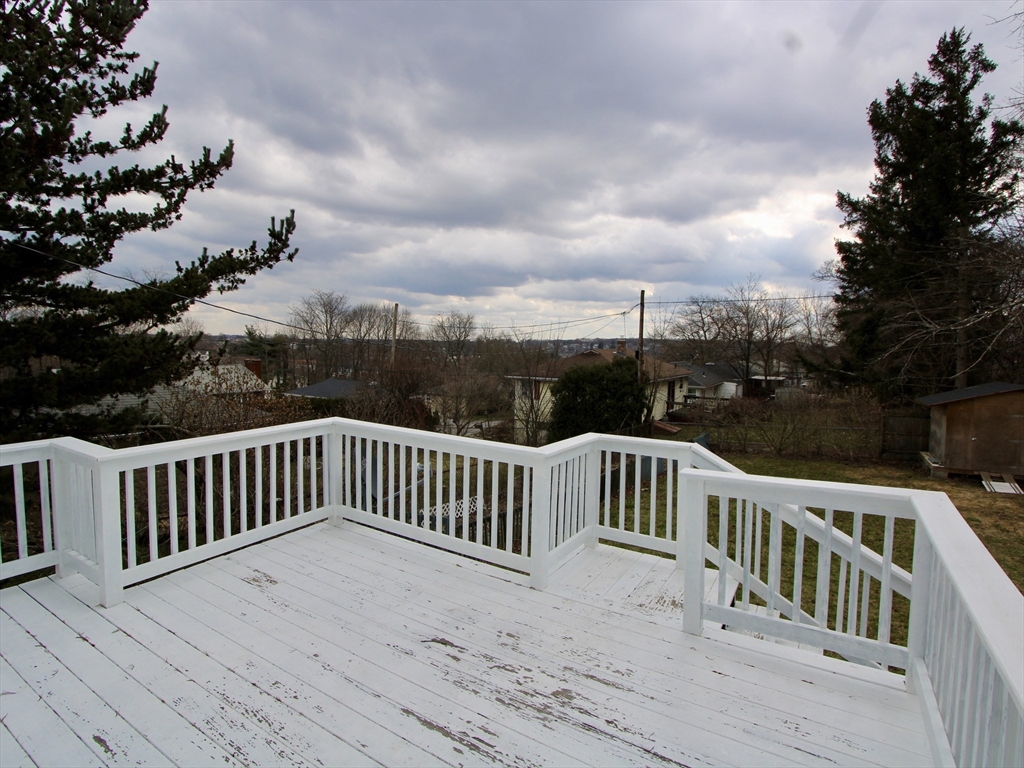 18 South Stowell Street Worcester, MA 01604 - Photo 15 of 16 a view of a roof deck with wooden floor and fence