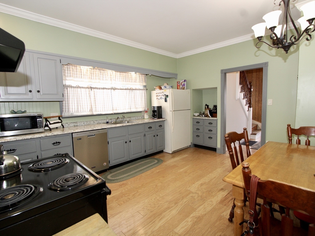 18 South Stowell Street Worcester, MA 01604 - Photo 3 of 16 a kitchen with a sink appliances and cabinets