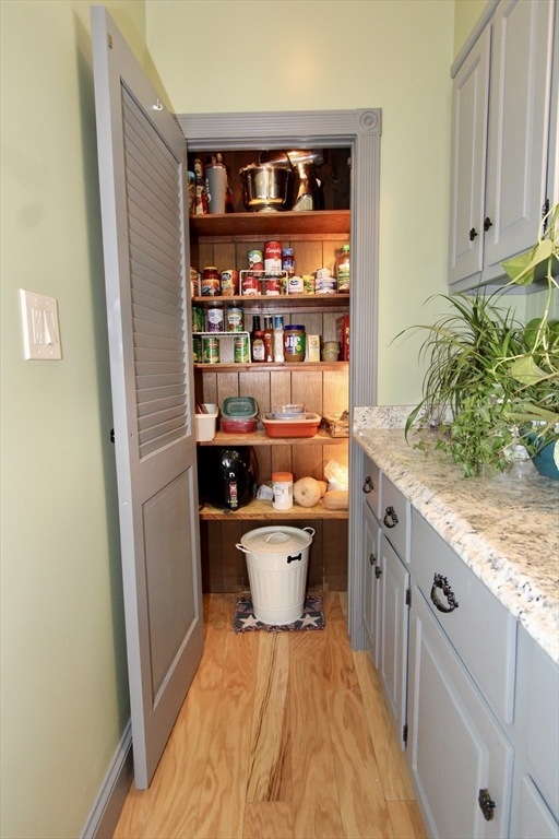 18 South Stowell Street Worcester, MA 01604 - Photo 5 of 16 a room with stainless steel appliances wooden floor and view of kitchen